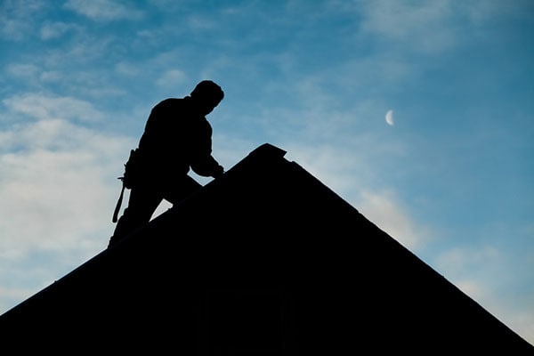 Roofing Contractors at Dusk